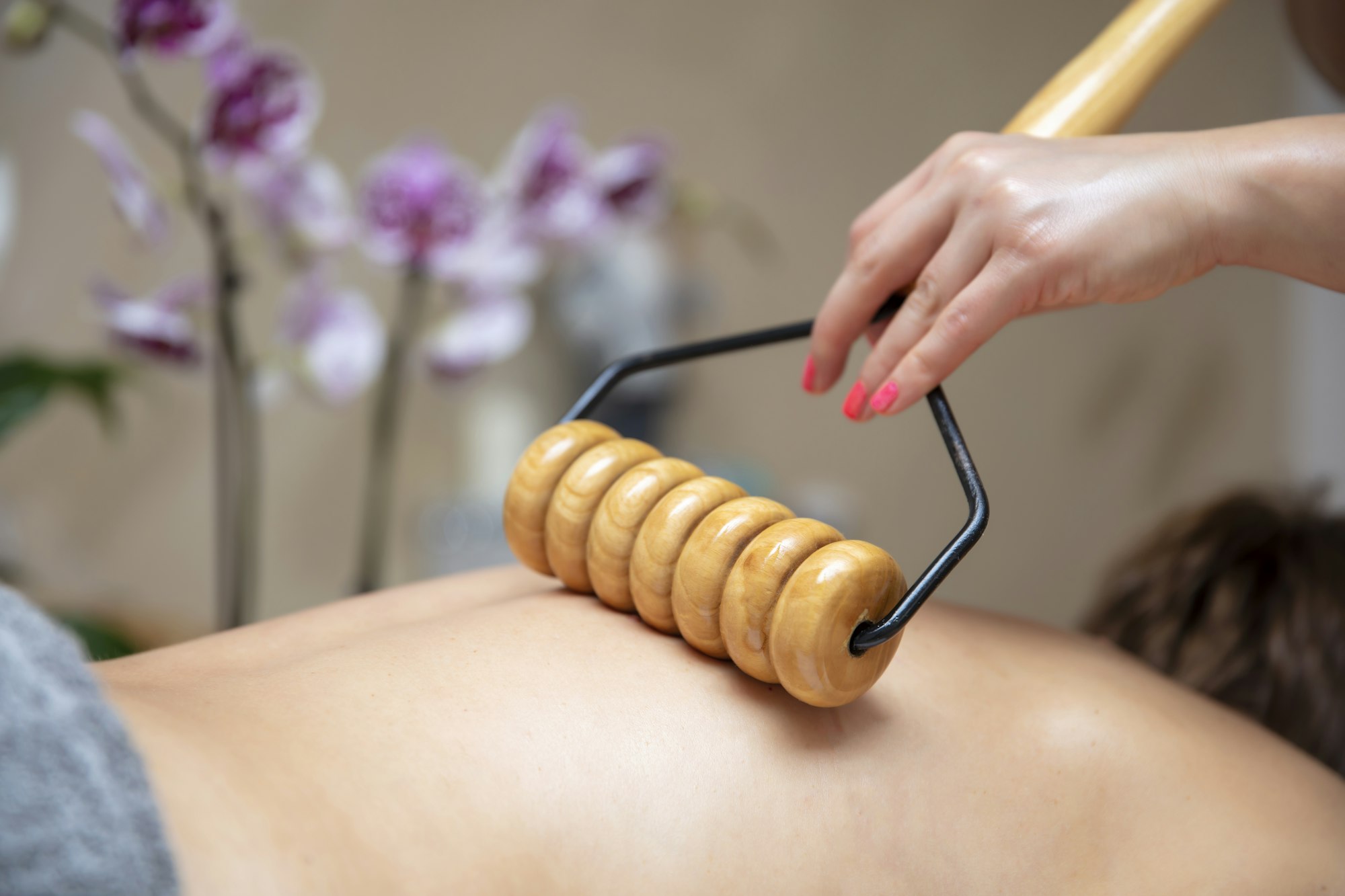 Maderotherapy anti-cellulite massage with wooden roller massager